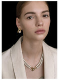 UZL DESIGN ABSTRACT EARRINGS WITH PEARL DETAIL IN GOLD PLATE - boopdo