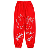 MAXIMARTIN MIXED PATTERN NEW YEAR RELAXED JOGGER PANTS IN RED - boopdo